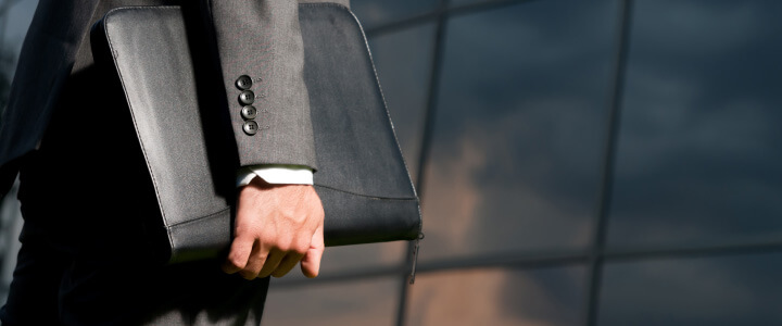 closeup of businessman holding briefcase